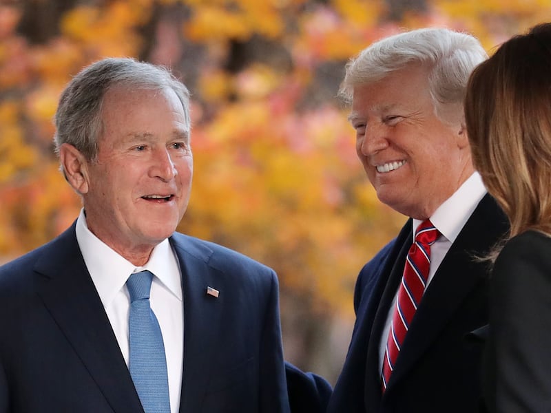 Former first lady Laura Bush and former President George W. Bush greet President Donald Trump and first lady Melania Trump outside of Blair House December 04, 2018 in Washington, DC. The Trumps were paying a condolence visit to the Bush family who are in Washington for former President George H.W. Bush’s state funeral and related honors.