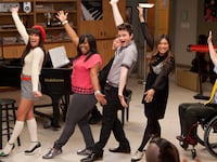 Characters from the TV show "Glee" sing and dance.