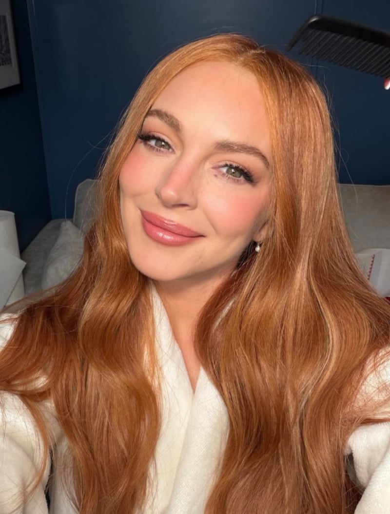 Lindsay Lohan posted multiple pictures with her new vibrant red hair.