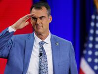 Oklahoma Governor Kevin Stitt gestures onstage at the Conservative Political Action Conference (CPAC) in Dallas, Texas, U.S., August 5, 2022.