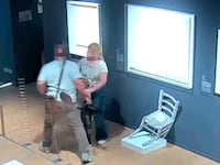 A tourist couple flees after destroying the “Van Gogh chair” at the Palazzo Maffei in Verona.