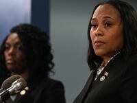 Fulton County District Attorney Fani Willis speaks during a news conference.