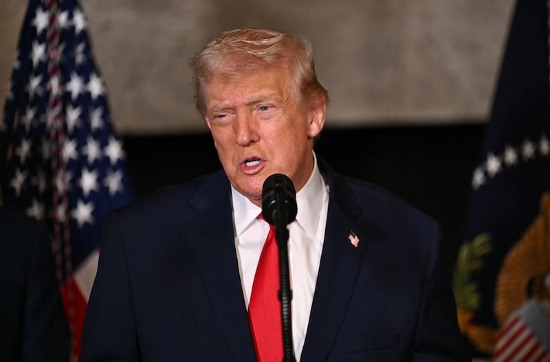 US President Donald Trump takes questions at Mar-a-Lago in Palm Beach, Florida, on December 22, 2025.