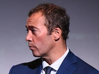 Will Lewis speaks on a panel.