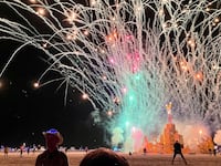 A security guard keeps people back during the annual Burning Man Festival on September 4, 2023.