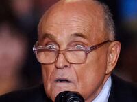 Rudy Giuliani speaks on stage at a Donald Trump event.