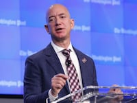 Jeff Bezos speaks from a podium.