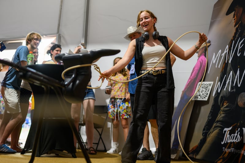 WASHINGTON, DC - JULY 03: A girl tries to lasso a fake bull at the Wyoming tent at the The Great American State Fair after it was reopened following an earlier closure due to extreme temperatures on July 03, 2026 in Washington, DC. The Freedom 250-backed Great American State Fair celebrating the 250th anniversary of the United States closed from around 1PM until 5PM due to high temperatures. The fair runs through July 10th. (Photo by Alexi J. Rosenfeld/Getty Images)