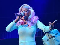 A picture of Cardi B, who chucked a microphone into her crowd mid-concert after a fan splashed her with their drink. The mic sold on eBay for nearly $100,000.