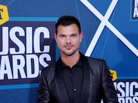 Taylor Lautner posing at the 2022 CMT Music Awards