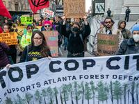 Protesters march against the construction of Cop City, a police training facility outside Atlanta, Georgia.