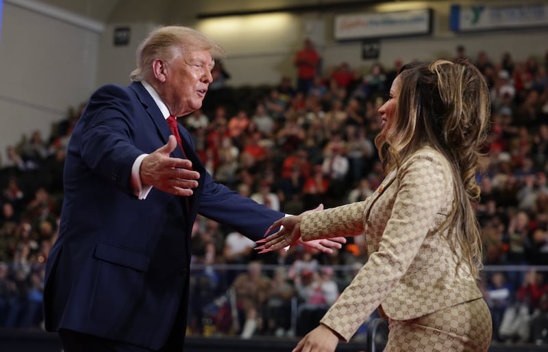 PORT HURON, MICHIGAN - OCTOBER 25: Singer Nicki Minaj greets President Donald Trump during a campaign rally at McMorran Place Sports & Entertainment Center on October 25, 2026 in Port Huron, Michigan. President Trump is in Michigan to rally for local Republican candidates ahead of next week's midterm elections. (Photo by Alex Wong/Getty Images)