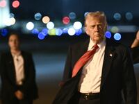 US President Donald Trump steps off Air Force One as he arrives at Palm Beach International Airport in West Palm Beach, Florida, on March 14, 2025. Trump is spending the weekend at his Mar-a-Lago resort. (Photo by Brendan SMIALOWSKI / AFP) (Photo by BRENDAN SMIALOWSKI/AFP via Getty Images)