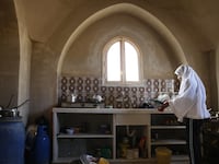 articles/2013/03/08/inside-the-gaza-kitchen-my-palestinian-shabbat-dinner/woman-in-gaza-kitchen-openz_rdgxn5