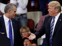 U.S. President Donald Trump extends his hand to Republican Senate candidate Matt Rosendale.