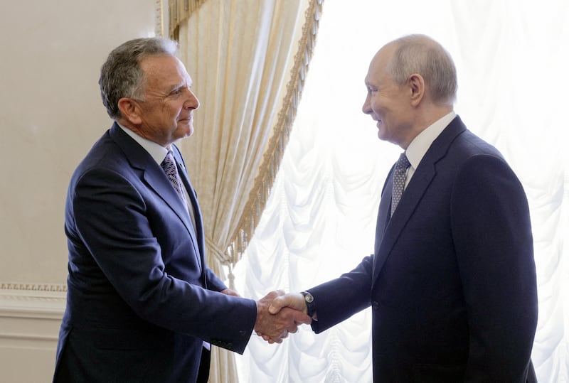 In this pool photograph distributed by the Russian state agency Sputnik, Russia's President Vladimir Putin (R) greets US special envoy Steve Witkoff (L) prior to their meeting in Saint Petersburg on October 21, 2026. (Photo by Gavriil GRIGOROV / POOL / AFP via Getty Images) / Editor's note: This image is distributed by the Russian state owned agency Sputnik