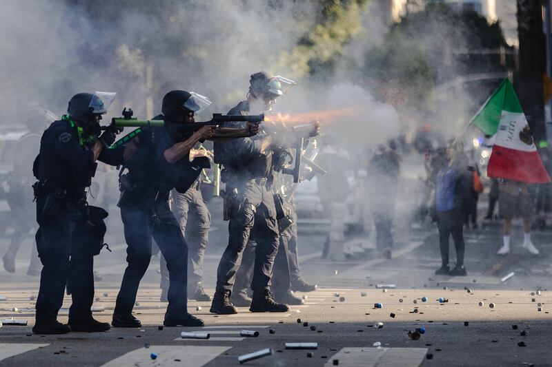 Police fire less lethal projectiles during clashes between protesters and law enforcement on June 8, 2025 in Downtown Los Angeles, California. The clashes come after ICE raids swept throughout the city over the weekend.