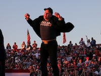 Tesla CEO and X owner Elon Musk jumps on the rally stage.