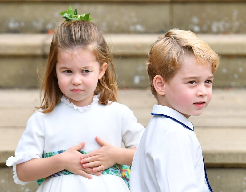 Princess Charlotte of Cambridge and Prince George of Cambridge in Amaia clothing at the wedding of Princess Eugenie of York and Jack Brooksbank October 12, 2018