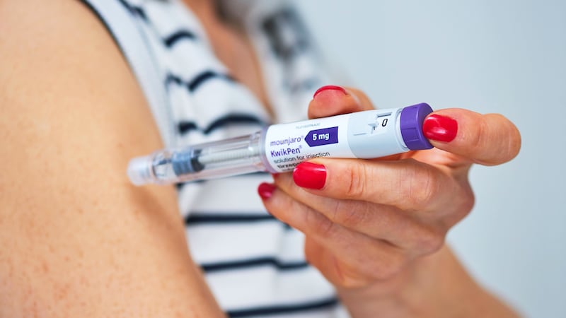 A woman injects himself with a Mounjaro pen on May 30, 2025 in London, England. Mounjaro is a treatment for weight loss and type 2 diabetes.