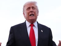 President Donald Trump gives brief remarks to members of the press after exiting Air Force One on November 9, 2025 at Joint Base Andrews, Maryland.
