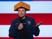 Musk arrived to a Green Bay town hall wearing a cheesehead hat.