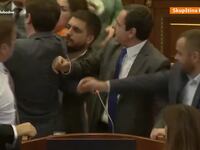 Kosovo lawmakers fight in the Assembly as Prime Minister Albin Kurti delivers a speech.
