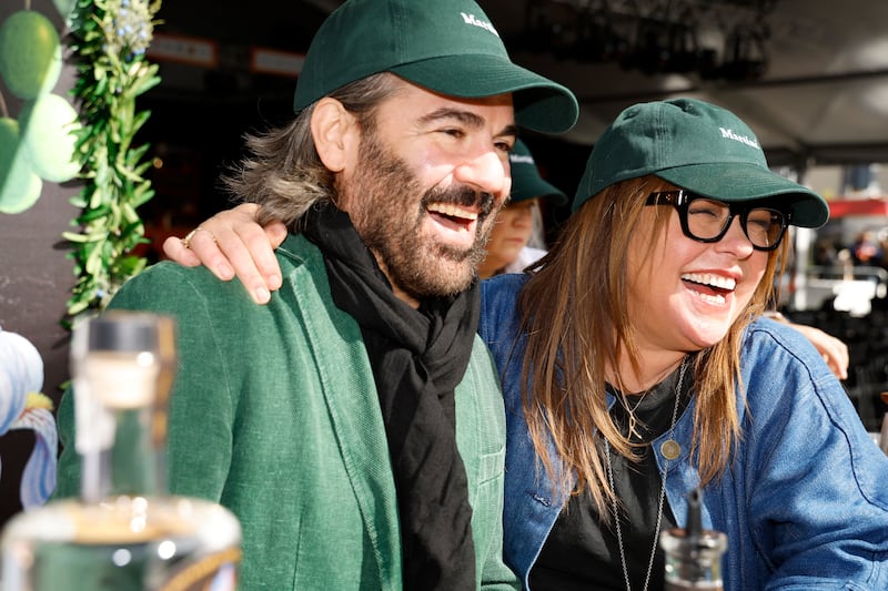 Husband-and-wife duo John Cusimano and Rachael Ray at the Staple Gin booth during the Food Network New York City Wine & Food Festival on October 15, 2023, in New York City.