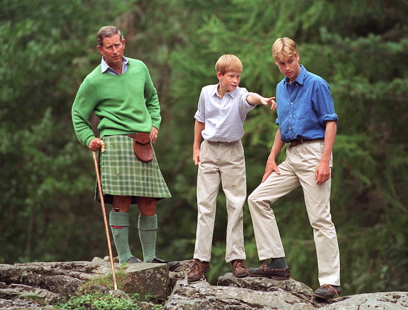 Prince Charles is pictured with his sons, Prince William and Prince Harry, at Glen Muick on the Balmoral Castle Estate in Scotland on August 16, 1997.