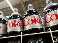 Bottles of Diet Coke which use Aspartame, an artificial sweetener set to be listed as a possible cancer risk by WHO.