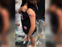 9-year-old girl gets permanent tattoo of American flag.