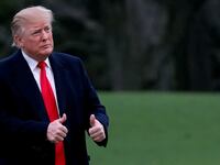 Donald Trump reacts as he returns to the White House in Washington, D.C., March 24, 2019.