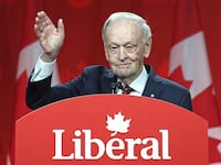 Canada's former Prime Minister Jean Chretien waves as he speaks after Mark Carney was elected as Canada's Liberal Leader and Prime Minister-elect during the election of the new Liberal Party leader, in Ottawa on March 9, 2025.