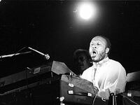 A black-and-white photo of Les McCann at the piano.