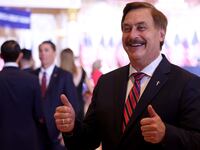 Mike Lindell speaks to the press before a Donald Trump speech in Florida.