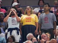 Protesters interrupt the U.S. Open semifinal between Coco Gauff and Karolina Muchova.
