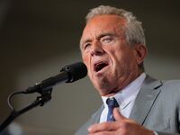 Robert F. Kennedy Jr. speaks during Republican presidential nominee and former U.S. President Donald Trump's campaign stop at manufacturer FALK Production in Walker, Michigan.
