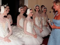 Princess Diana in short light blue dress which is part of the sale arriving at the Royal Albert Hall for a performance of Swan Lake by the English National Ballet.
