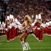 An Alabama Crimson Tide cheerleader performs ahead of the start of the NCAA National Championship college football game against the Notre Dame