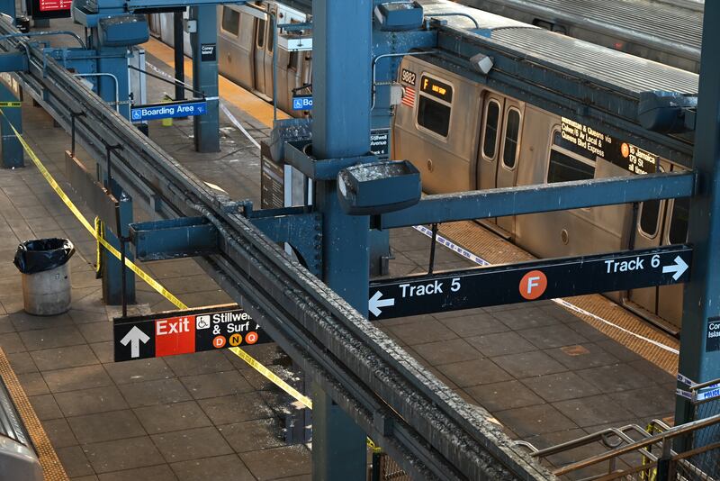CONEY ISLAND, BROOKLYN, NEW YORK, UNITED STATES - DECEMBER 22: Police investigate at the Coney Island-Stillwell Avenue Station in Brooklyn after a woman aboard a subway car was set on fire and died in New York, United States on December 22, 2024. Police believe the woman had been sleeping aboard the train when a man approached her and set her on fire. She was pronounced dead at the scene. (Photo by Kyle Mazza/Anadolu via Getty Images)
