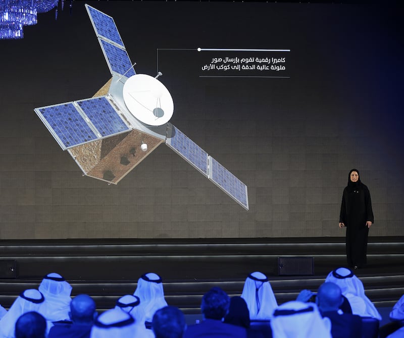 Amiri stands on stage during a ceremony to unveil the Mars Hope mission on May 6, 2015 in Dubai.