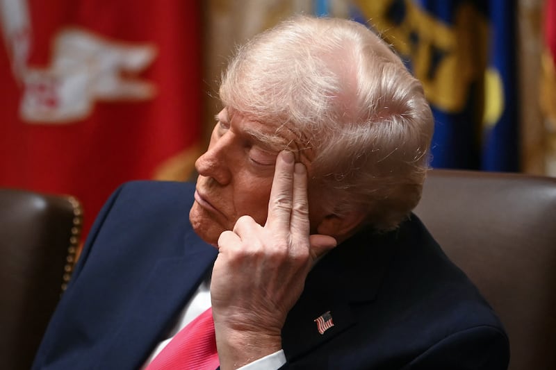 US President Donald Trump rests his eyes during his Cabinet meeting on Tuesday.