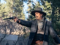 Kevin Costner holds a gun in ‘Horizon’