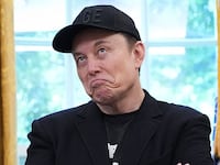 Tesla CEO Elon Musk speaks alongside U.S. President Donald Trump to reporters in the Oval Office of the White House on May 30, 2025 in Washington, DC. Musk, who served as an adviser to Trump and led the Department of Government Efficiency, announced he would leave his role in the Trump administration to refocus on his businesses. (Photo by Kevin Dietsch/Getty Images)