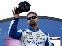 Ricky Stenhouse Jr., driver of the #47 Kroger Health/Icy Hot Chevrolet, waves to fans as he walks onstage during driver intros prior to the NASCAR Cup Series All-Star Race at North Wilkesboro Speedway.