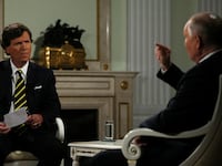 Tucker Carlson looking befuddled during an interview with Vladimir Putin on Feb. 6 in Moscow.