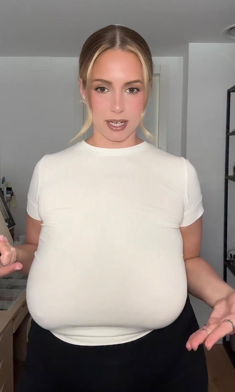 Ellen Larson said her breast had caused her back pain and made her posture poor.