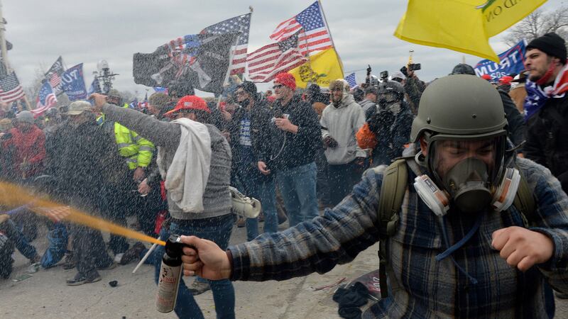 Trump supporters clash with police and security forces as people try to storm the US Capitol Building.