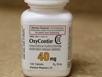 A bottle of prescription painkiller OxyContin, 40mg pills, made by Purdue Pharma L.D. sit on a counter at a local pharmacy, in Provo, Utah