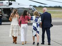 US President Joe Biden (R), First Lady Jill Biden and family walk to Marine One upon arrival at Francis S. Gabreski Airport in Westhampton Beach, New York on June 29, 2024.
